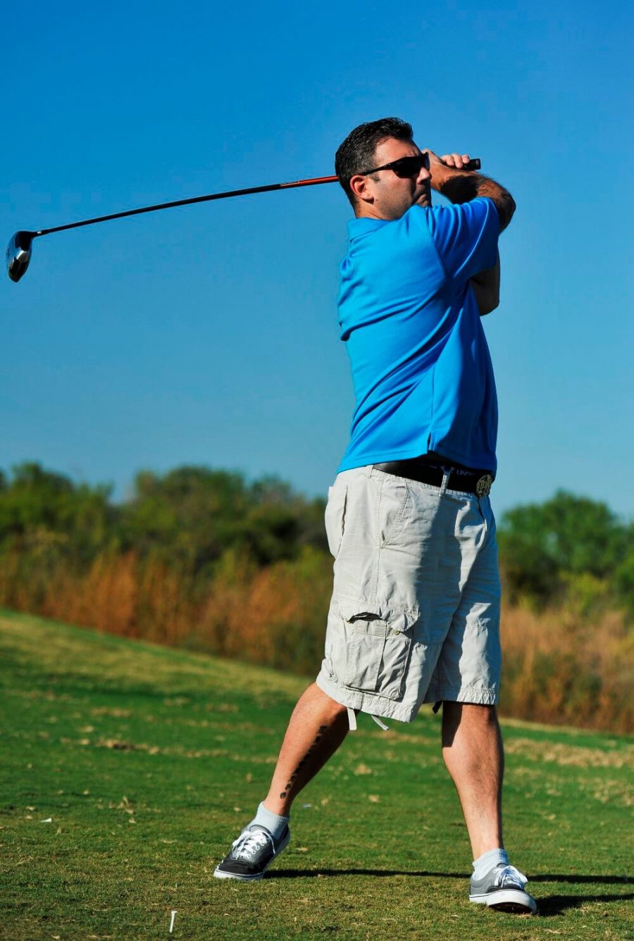 Golfer in blue shirt