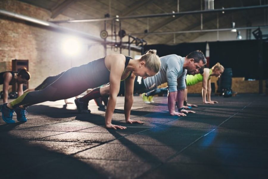 Group of adults doing push up exercises