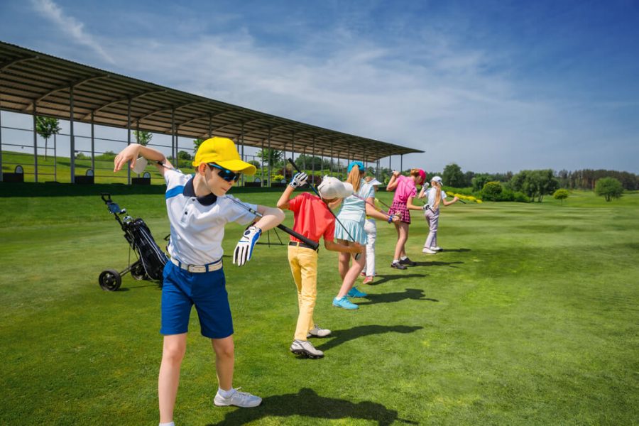 Kids warming up at golf school