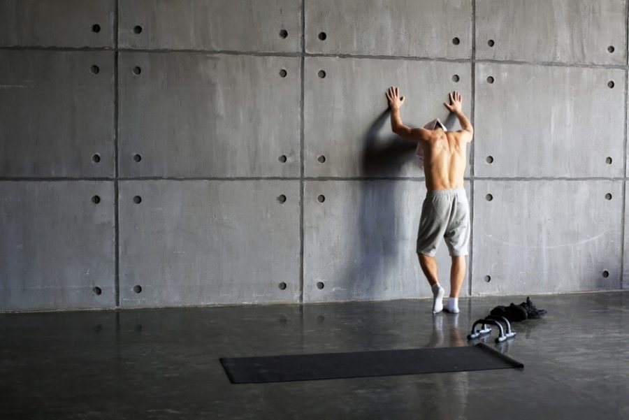 Man at the wall in the gym