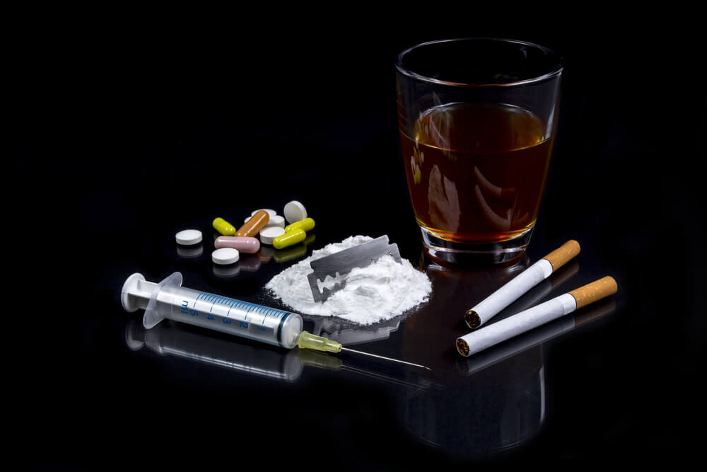 Collection of different hard drugs Heroin, Pills, Tobacco and Alcohol