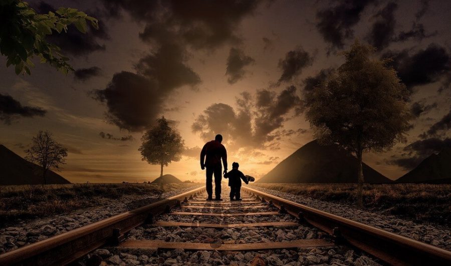 Father and son at the train