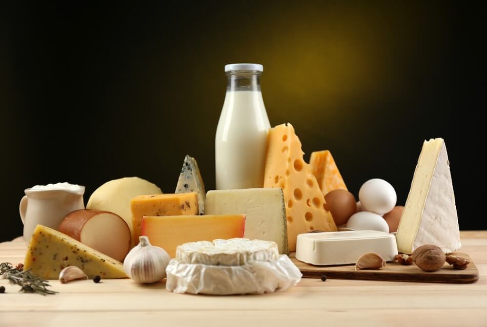 Tasty dairy products on wooden table