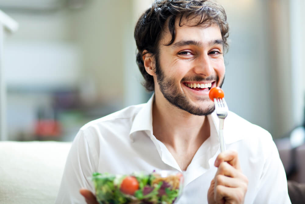 man eating a healthy salad