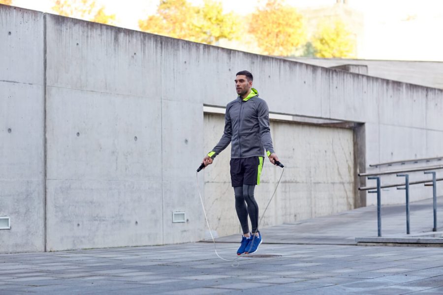 Six Degree Flow - man exercising with jump-rope outdoors