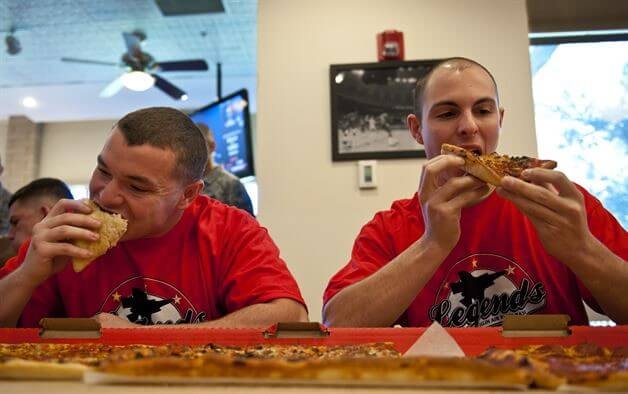 Men eating pizza