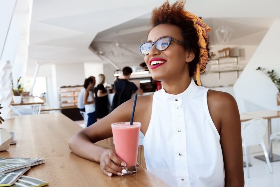 african girl drinking smoothie