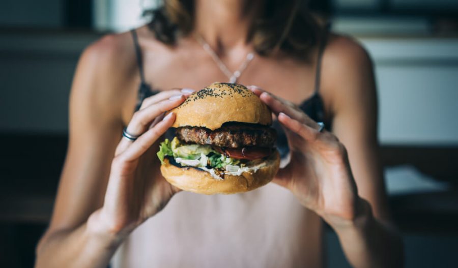 girl holding burger